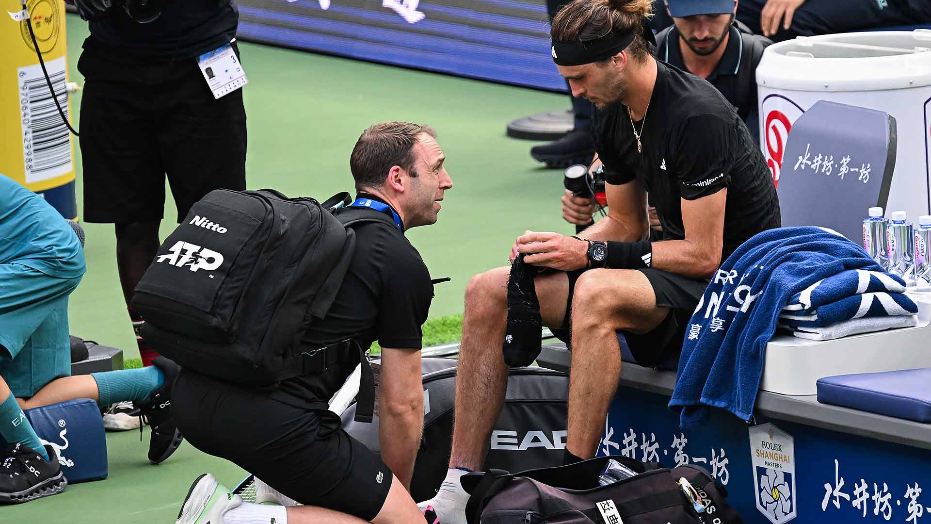 Zverev limps through Shanghai opener amid injury woes